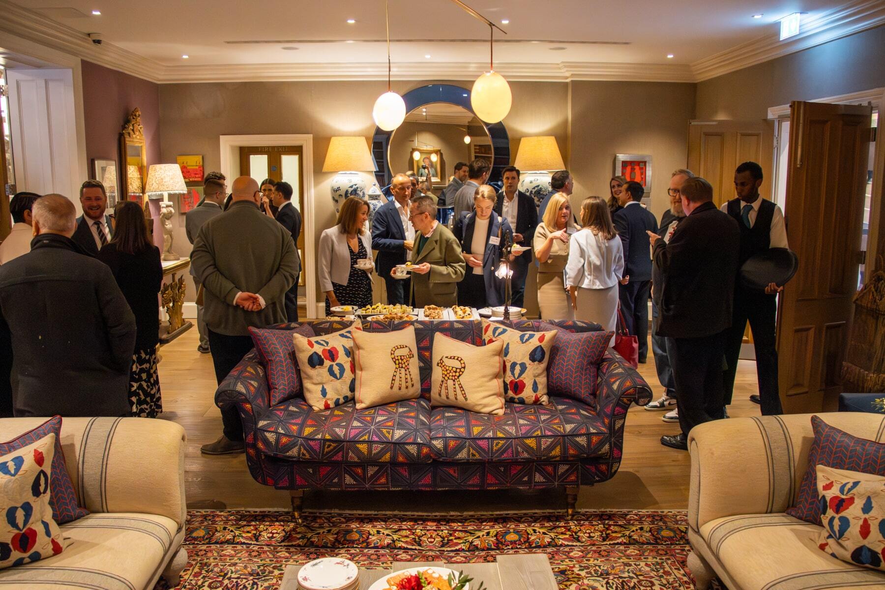 A busy crowd mingles as the panel discussion ends 