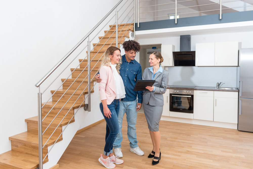 Estate agent showing around potential tenants